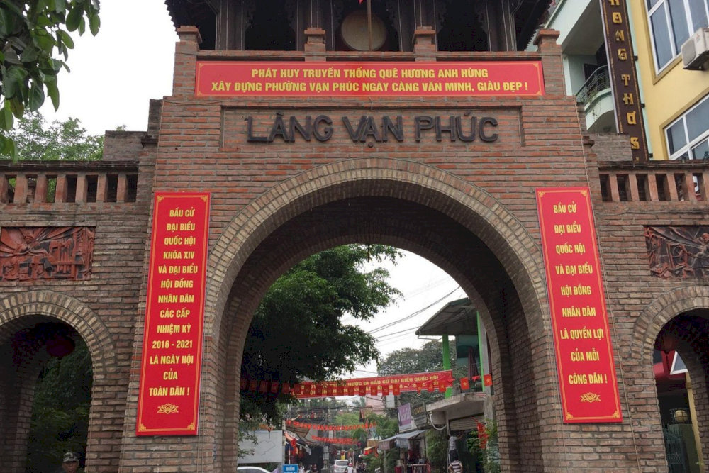 Built from rustic red bricks, the gate embodies classic Vietnamese village architecture